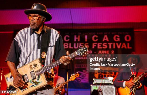 American Blues, R&B, and Rock musician Bo Diddley plays guitar with his group, the Bo Diddley Reunion Band, on the Petrillo Music Shell stage at the...