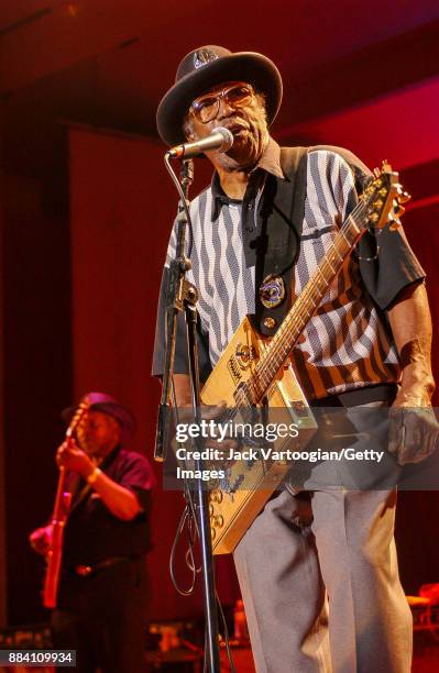 American Blues, R&B, and Rock musician Bo Diddley plays guitar with his group, the Bo Diddley Reunion Band, on the Petrillo Music Shell stage at the...