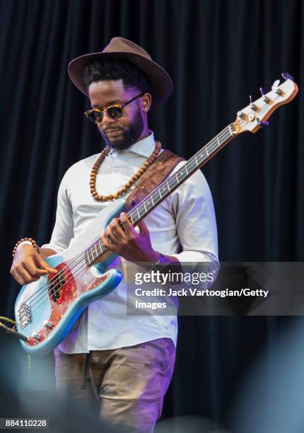 American Jazz musician Ben Williams plays electric bass guitar as he performs with Alicia Olatuja's band on the final day of the 25th Annual Charlie...