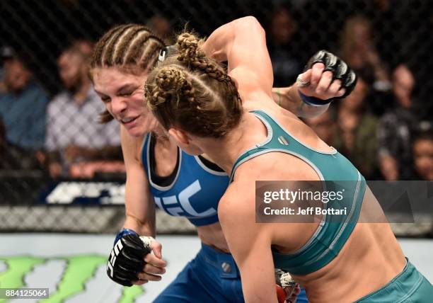 Barb Honchak punches Lauren Murphy in their women's flyweight bout during the TUF Finale event inside Park Theater on December 01, 2017 in Las Vegas,...