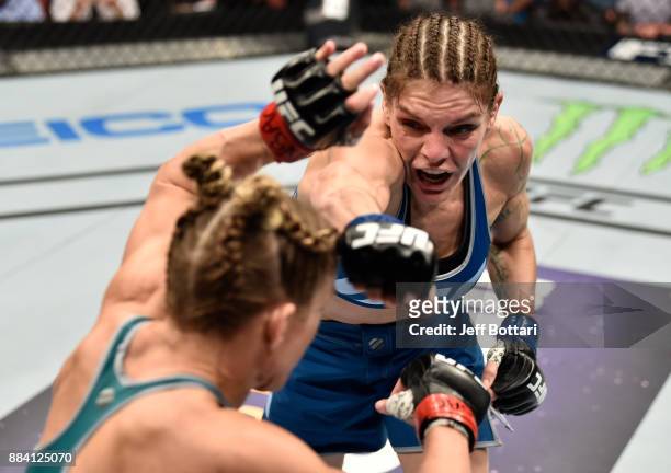 Lauren Murphy punches Barb Honchak in their women's flyweight bout during the TUF Finale event inside Park Theater on December 01, 2017 in Las Vegas,...