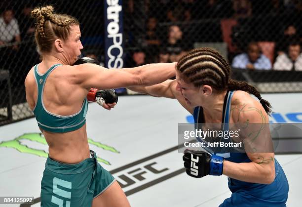 Lauren Murphy and Barb Honchak trade punches in their women's flyweight bout during the TUF Finale event inside Park Theater on December 01, 2017 in...