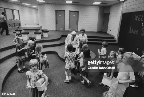 Colonel Harland David Sanders and his wife Claudia in visit an elementary school in Kentucky. September 1974