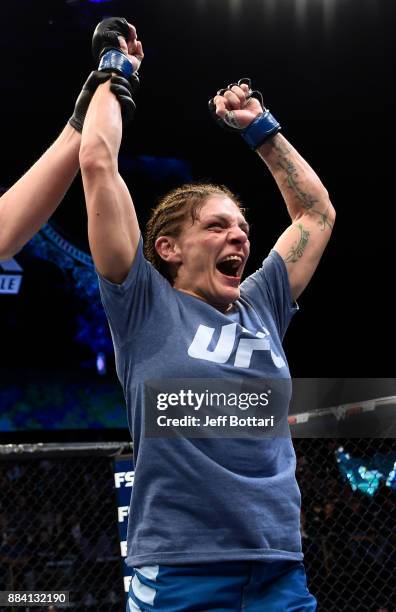 Lauren Murphy celebrates her decision victory over Barb Honchak in their women's flyweight bout during the TUF Finale event inside Park Theater on...