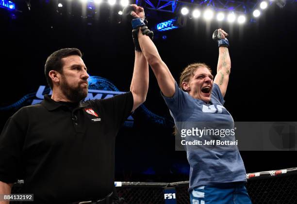 Lauren Murphy celebrates her decision victory over Barb Honchak in their women's flyweight bout during the TUF Finale event inside Park Theater on...