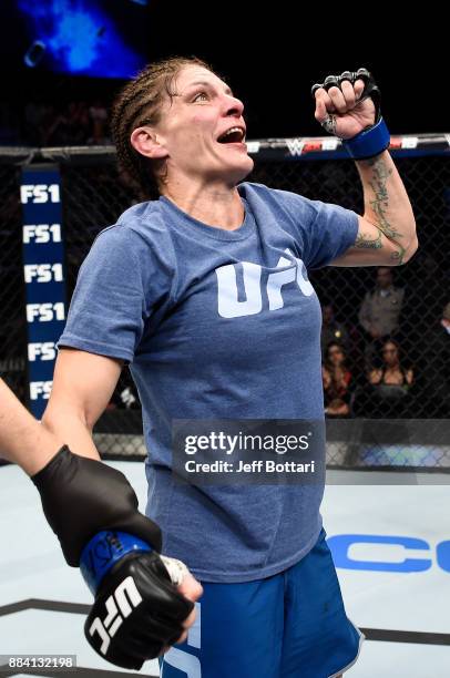 Lauren Murphy celebrates her decision victory over Barb Honchak in their women's flyweight bout during the TUF Finale event inside Park Theater on...