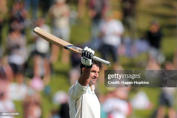 Colin de Grandhomme of New Zealand celebrates his maiden test century during day two of the Test match series between New Zealand Blackcaps and the...