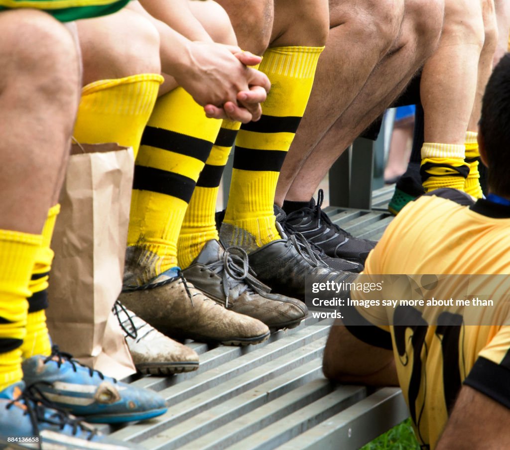 Detail of soccer players legs after a difficult match.