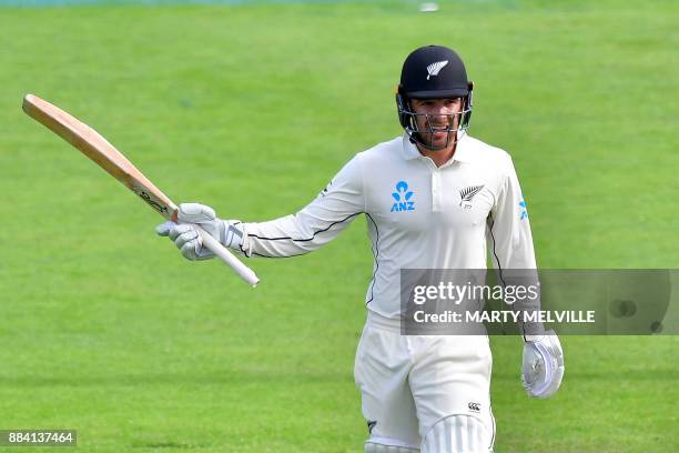 New Zealand's Tom Blundell celebrates 50 runs during day two of the first Test cricket match between New Zealand and the West Indies at the Basin...