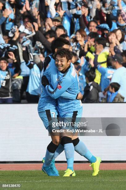 Hiroyuki Abe of Kawasaki Frontale celebrates scoring the opening goal with his team mate Shintaro Kurumaya during the J.League J1 match between...