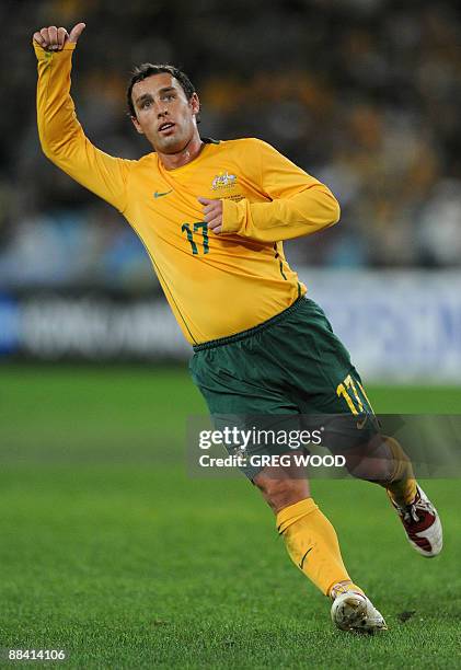 Australia's Scott McDonald gestures to a teammate during his team's World Cup Asia Zone qualifier football match against Bahrain in Sydney on June...