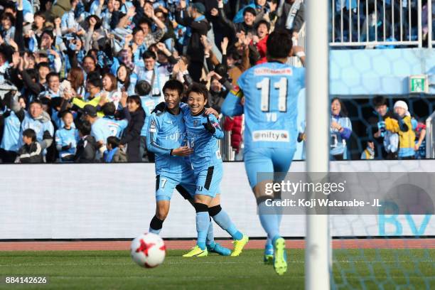 Hiroyuki Abe of Kawasaki Frontale celebrates scoring the opening goal with his team mate Shintaro Kurumaya and Yu Kobayashi during the J.League J1...