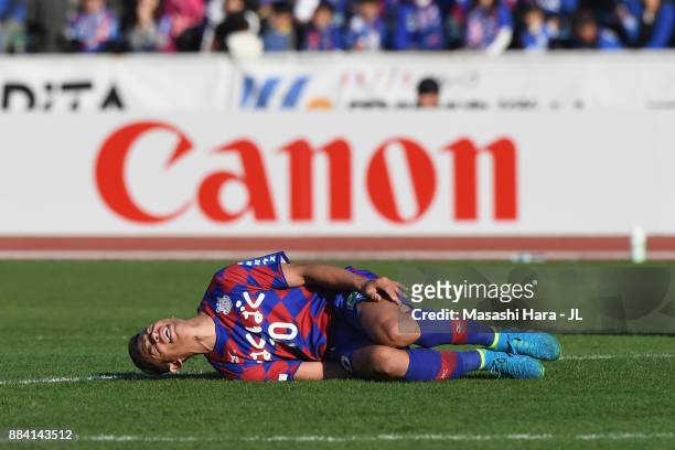 Dudu of Ventforet Kofu lies injured during the J.League J1 match between Ventforet Kofu and Vegalta Sendai at Yamanashi Chou Bank Stadium on December...