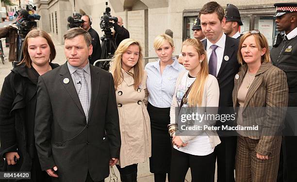 George Kinsella , father of murdered schoolboy Ben Kinsella, stands with family members Holly, Jade, Brooke, Georgia, Christopher and Deborah outside...