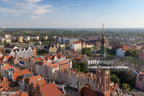 view of old buildings and main town hall's tower at the main town (old town) and beyond from above in gdansk, poland, on a sunny day in the summer. - above and beyond stock pictures, royalty-free photos & images