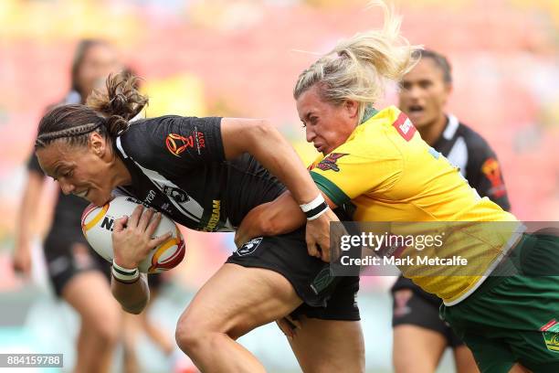 Honey Hireme of the Ferns is tackled by Ruan Sims of the Jillaroos during the 2017 Rugby League Women's World Cup Final between Australia and New...