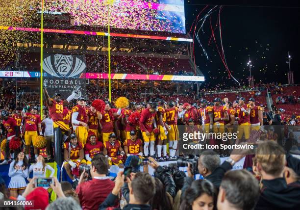 The USC Trojans celebrate their 31-28 win after the Pac-12 Championship game between the Stanford Cardinal and the USC Trojans on December 1, 2017 at...