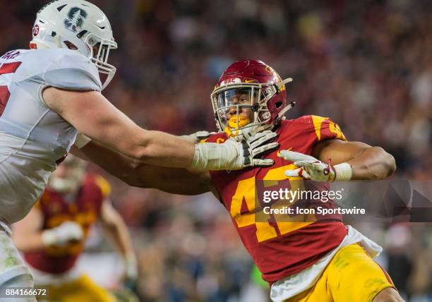 Trojans linebacker Uchenna Nwosu battles with his defender as he tries to get around him during the Pac-12 Championship game between the Stanford...