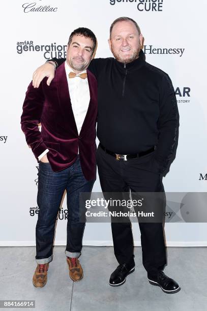 Actor Anthony Carrino and CEO of amfAR Kevin Robert Frost attend the 2017 amfAR generationCURE Holiday Party on December 1, 2017 in New York City.