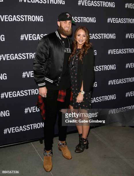 Major League Baseball player Bryce Harper and his wife Kayla Harper attend the Vegas Strong Benefit Concert at T-Mobile Arena to support victims of...