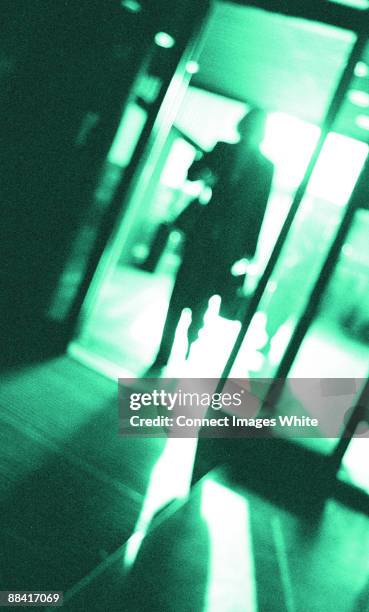 business woman walking - woman walking out door silhouette stock pictures, royalty-free photos & images