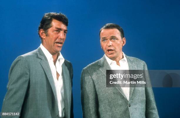 Entertainers Dean Martin and Frank Sinatra sing on stage during the taping of 'The Dean Martin, Frank Sinatra Christmas Special' circa December, 1967...