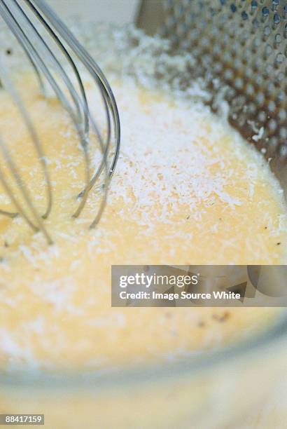 preparing an omelette - cucinare fotografías e imágenes de stock