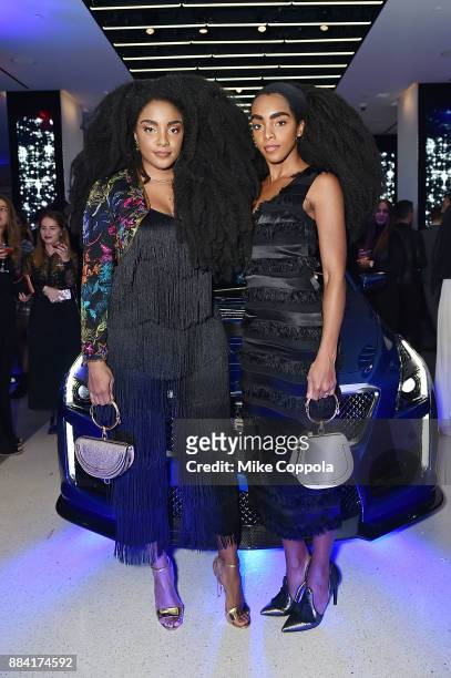 Models Cipriana Quann and TK Quann attend the 2017 amfAR generationCURE Holiday Party on December 1, 2017 in New York City.