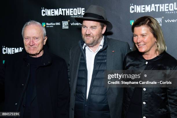 Director of the movie Xavier Beauvois standing between Producers of the movie, President of Pathe Jerome Seydoux and his wife Sophie attend the "Les...