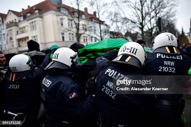 Left-wing protesters clash with police forces outside the Hannover Congress Centrum prior todays AfD federal congress on December 2, 2017 in Hanover,...