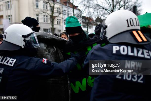 Left-wing protesters clash with police forces outside the Hannover Congress Centrum prior todays AfD federal congress on December 2, 2017 in Hanover,...