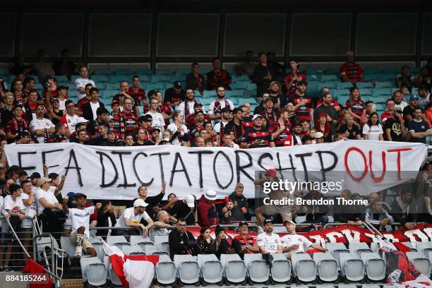 Wanderers fans unveil a sign directed at the FFA during the round nine A-League match between the Western Sydney Wanderers and the Brisbane Roar at...