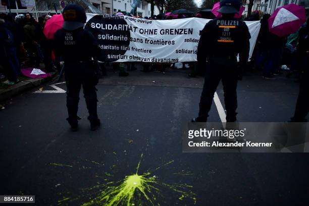 Left-wing protesters block the way in front of police forces outside the Hannover Congress Centrum prior to today's AfD federal congress on December...