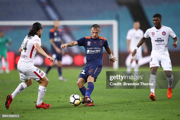 Eric Bautheac of the Roar passes the ball to a team mate during the round nine A-League match between the Western Sydney Wanderers and the Brisbane...