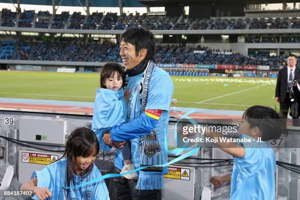 Kengo Nakamura of Kawasaki Frontale celebrates his team's J.League Champions with his children after the J.League J1 match between Kawasaki Frontale...