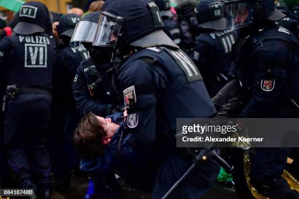 Left-wing protesters clash with police forces outside the Hannover Congress Centrum prior to today's AfD federal congress on December 2, 2017 in...