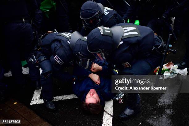 Left-wing protesters clash with police forces outside the Hannover Congress Centrum prior to today's AfD federal congress on December 2, 2017 in...