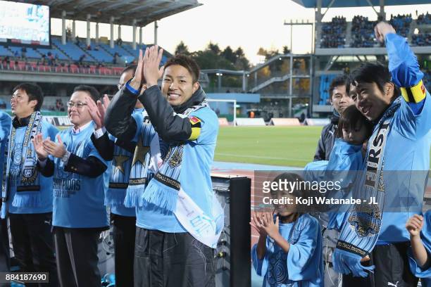 Yu Kobayashi and Kengo Nakamura of Kawasaki Frontale celebrate their J.League Champions with their children after the J.League J1 match between...