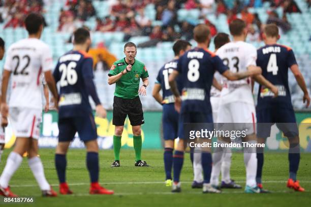Referee, Adam Fielding looks on during the round nine A-League match between the Western Sydney Wanderers and the Brisbane Roar at ANZ Stadium on...