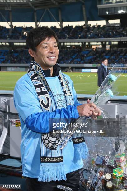 Head coach Toru Oniki of Kawasaki Frontale celebrates his side's J.League Champios with supporters after the J.League J1 match between Kawasaki...