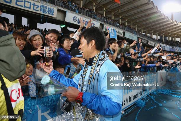 Head coach Toru Oniki of Kawasaki Frontale celebrates his side's J.League Champios with supporters after the J.League J1 match between Kawasaki...