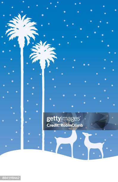 palm trees and reindeer on a blue snowing background - christmas palm tree stock illustrations