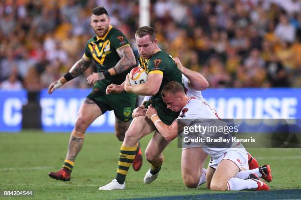 Michael Morgan of the Kangaroos is tackled during the 2017 Rugby League World Cup Final between the Australian Kangaroos and England at Suncorp...