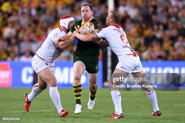 Michael Morgan of the Kangaroos is tackled during the 2017 Rugby League World Cup Final between the Australian Kangaroos and England at Suncorp...