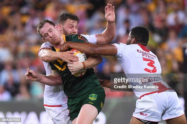 Michael Morgan of the Kangaroos is tackled during the 2017 Rugby League World Cup Final between the Australian Kangaroos and England at Suncorp...