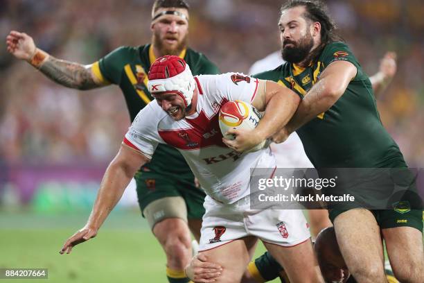 Chris Hill of England is tackled by Aaron Woods of Australia during the 2017 Rugby League World Cup Final between the Australian Kangaroos and...