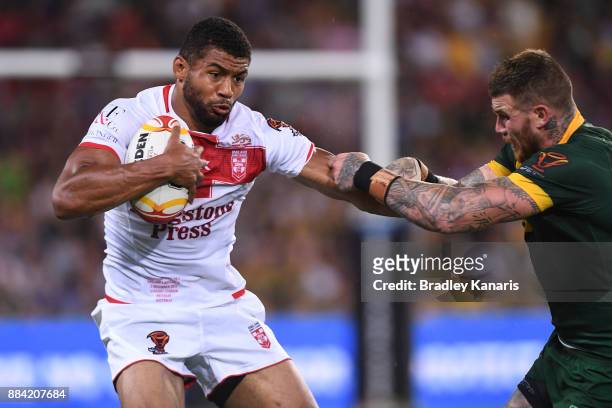 Kallum Watkins of England is tackled during the 2017 Rugby League World Cup Final between the Australian Kangaroos and England at Suncorp Stadium on...