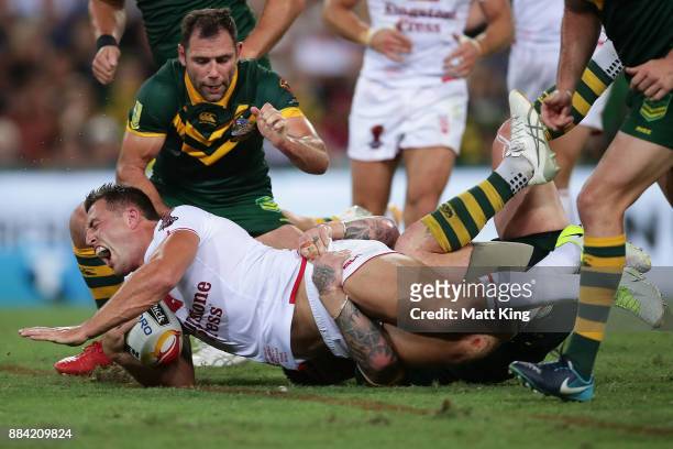 Sam Burgess of England is tackled during the 2017 Rugby League World Cup Final between the Australian Kangaroos and England at Suncorp Stadium on...
