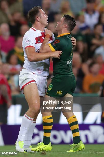 Cooper Cronk of the Kangaroos and Sam Burgess of England have words during the 2017 Rugby League World Cup Final between the Australian Kangaroos and...