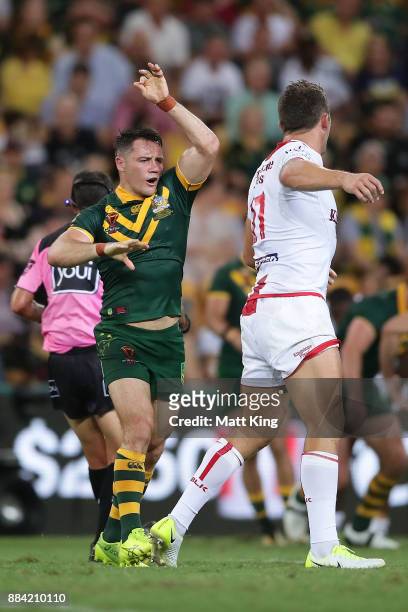 Cooper Cronk of the Kangaroos and Sam Burgess of England have words during the 2017 Rugby League World Cup Final between the Australian Kangaroos and...
